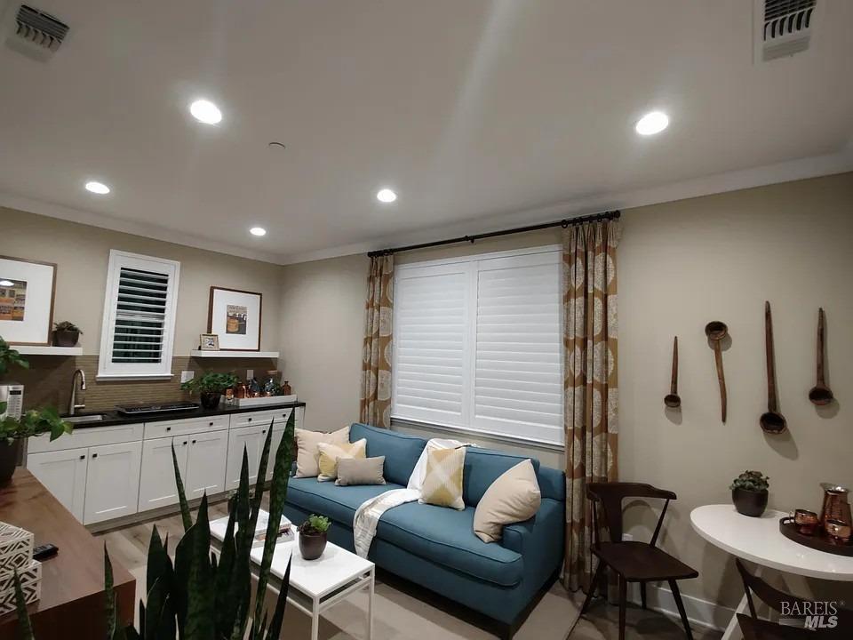 706 Hydrangea Drive Vacaville, CA 95687 - Photo 3 of 10 a living room with furniture and a table