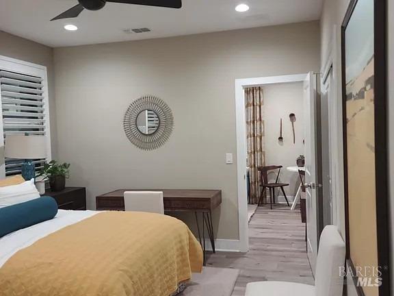 706 Hydrangea Drive Vacaville, CA 95687 - Photo 4 of 10 a bedroom with a bed and a table with mirror