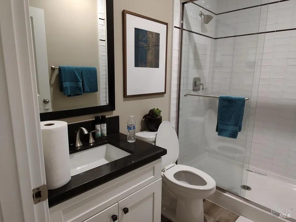 706 Hydrangea Drive Vacaville, CA 95687 - Photo 5 of 10 a bathroom with a sink a toilet and shower