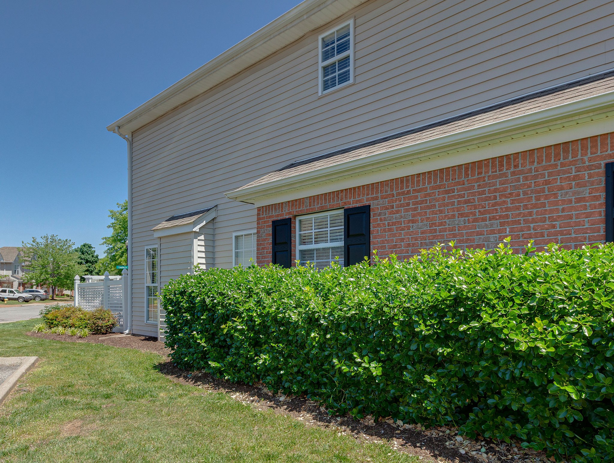 401 Compton Lane Franklin, TN 37069 - Photo 2 of 19 a view of a house with a small yard and plants