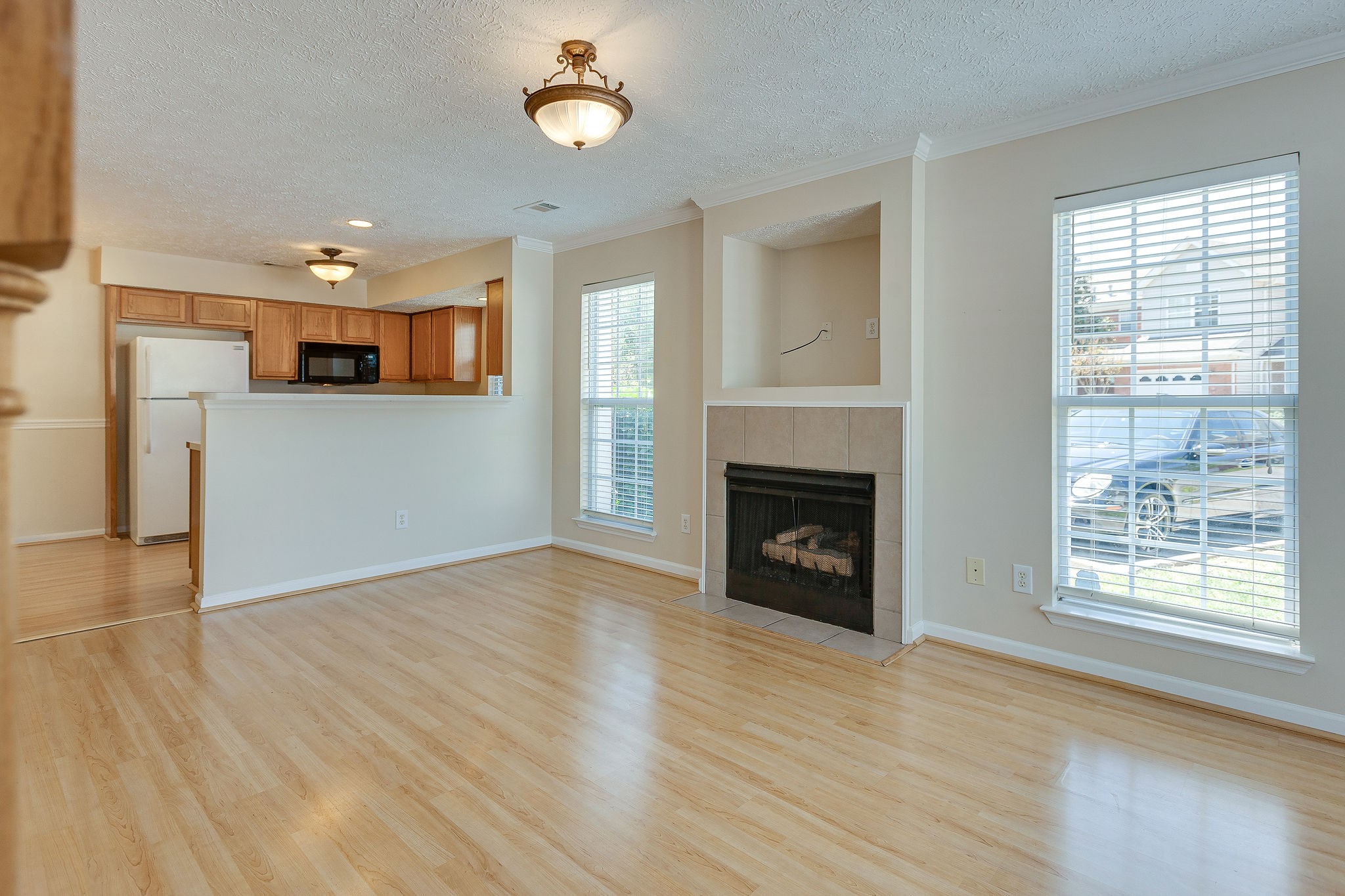 401 Compton Lane Franklin, TN 37069 - Photo 5 of 19 a view of a kitchen and an empty room with a fireplace