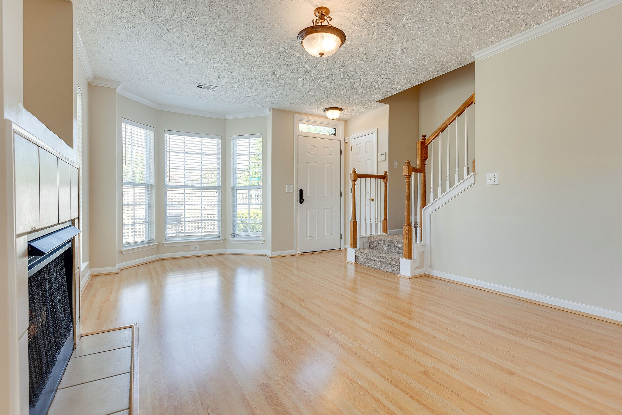 401 Compton Lane Franklin, TN 37069 - Photo 6 of 19 a view of an empty room with wooden floor and a window