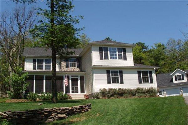 1562 Bush Road Cresco, PA 18326 - Photo 1 of 30 a front view of a house with a yard