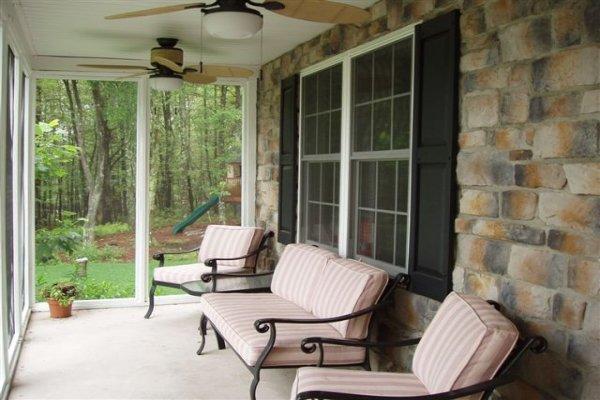 1562 Bush Road Cresco, PA 18326 - Photo 15 of 30 a view of a porch with chairs and a yard