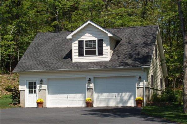 1562 Bush Road Cresco, PA 18326 - Photo 2 of 30 a front view of a house with a yard and garage