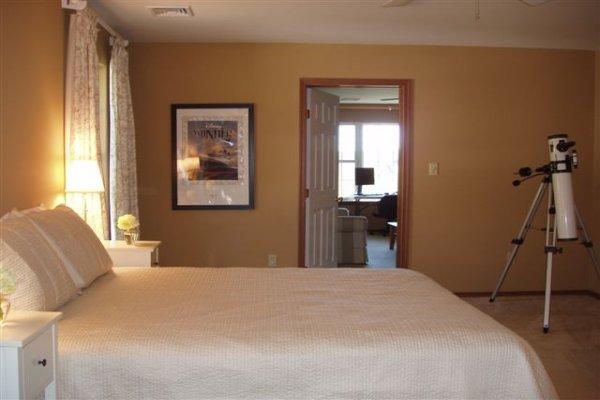 1562 Bush Road Cresco, PA 18326 - Photo 26 of 30 a bedroom with a bed and a chandelier