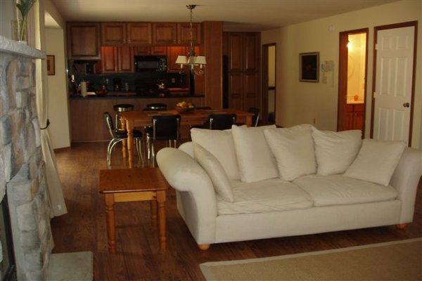 1562 Bush Road Cresco, PA 18326 - Photo 10 of 30 a living room with furniture a flat screen tv and a refrigerator