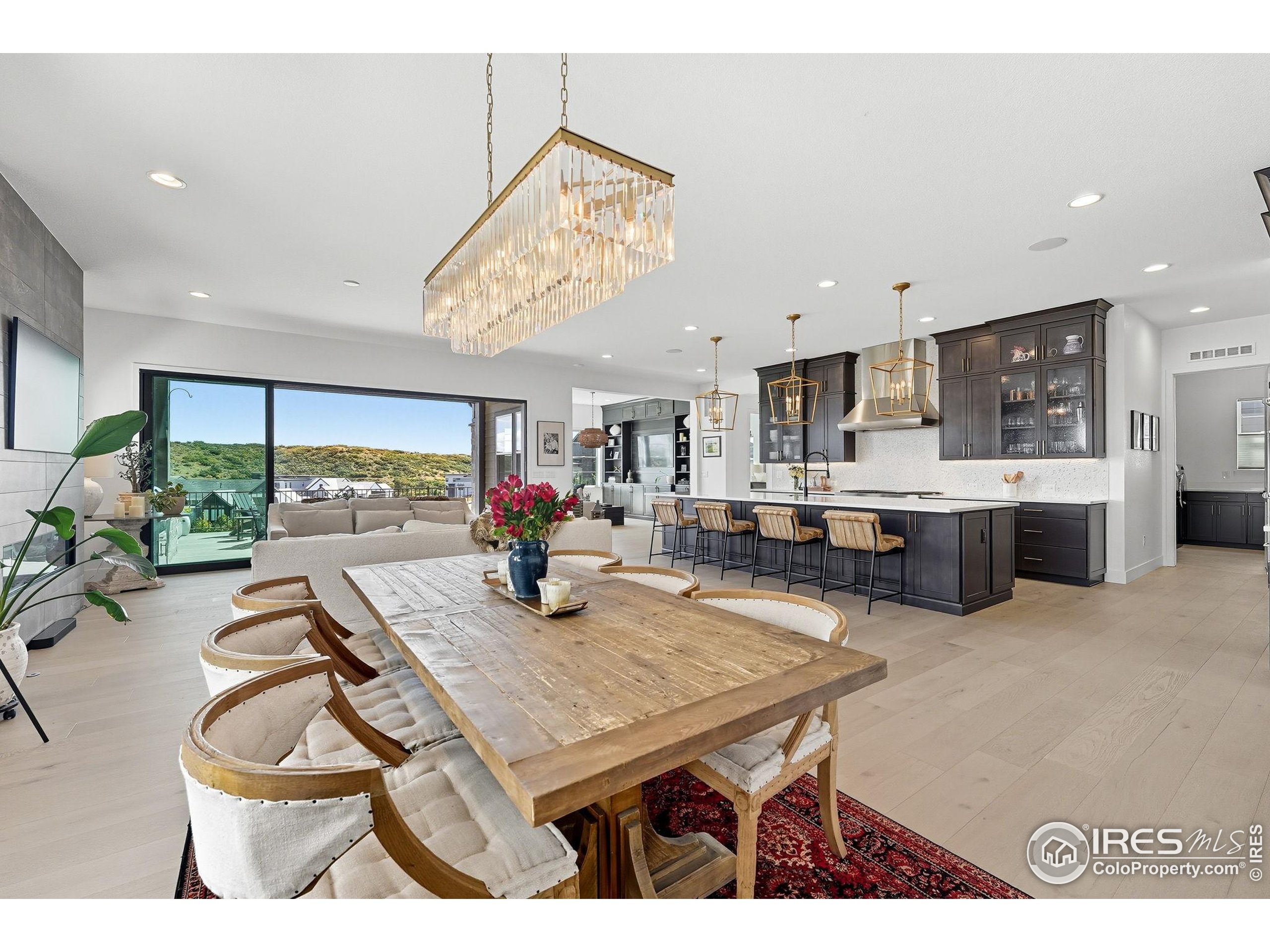 a room with furniture and a kitchen view