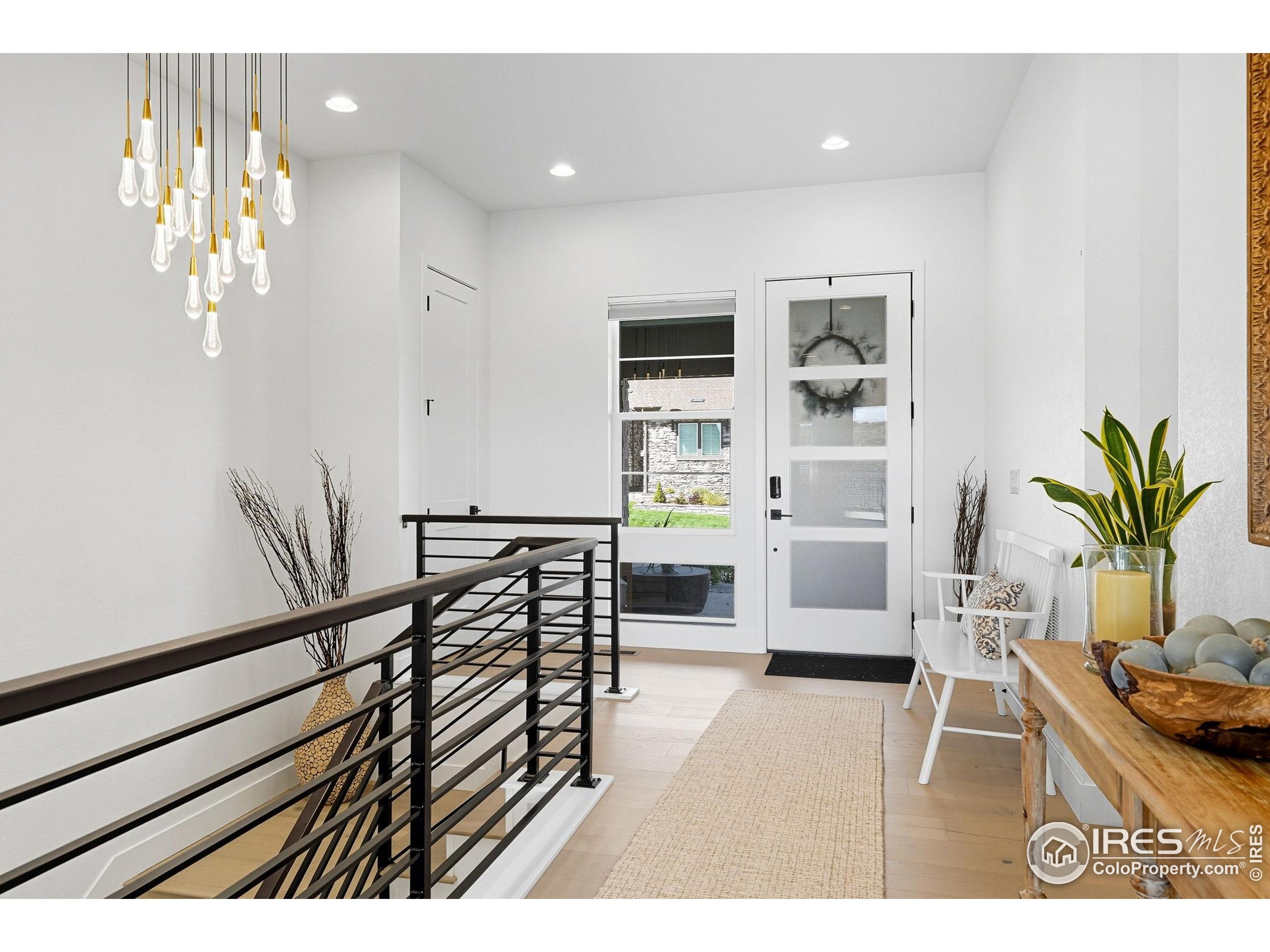 7382 Canyonpoint Road Castle Pines, CO 80108 - Photo 23 of 49 a view of living room and kitchen with furniture