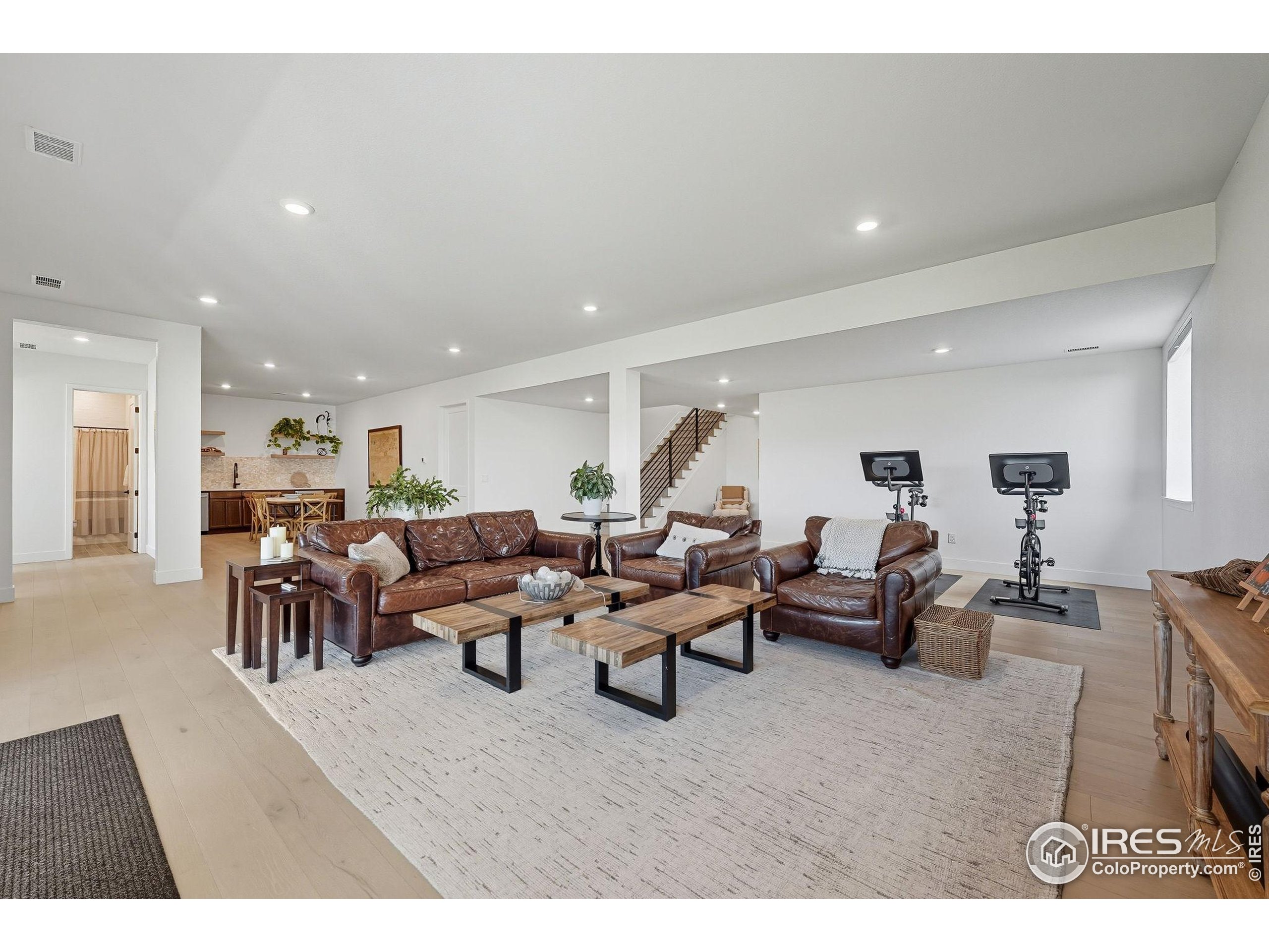 7382 Canyonpoint Road Castle Pines, CO 80108 - Photo 33 of 49 a living room with lots of furniture