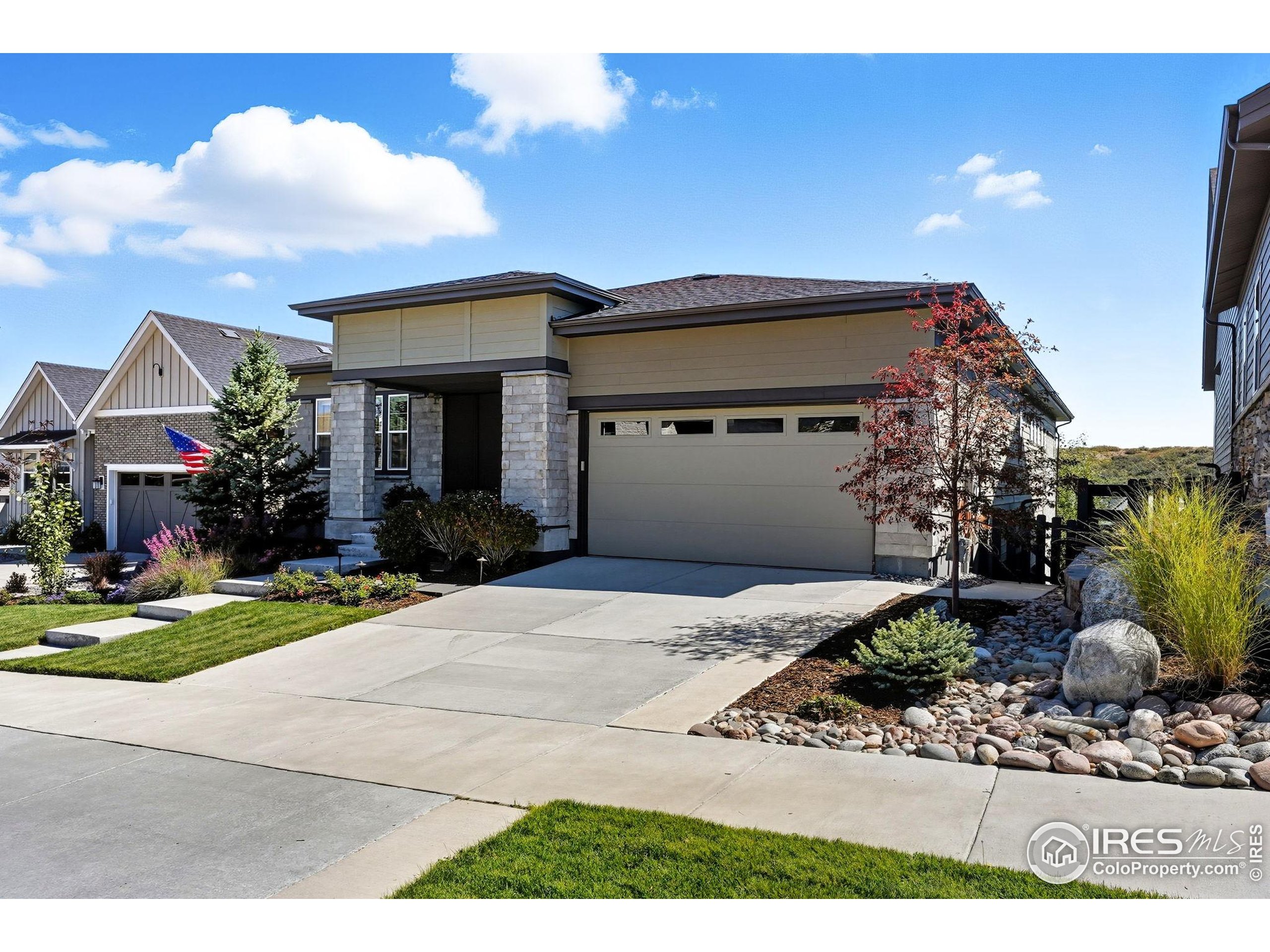 7382 Canyonpoint Road Castle Pines, CO 80108 - Photo 10 of 49 a front view of a house with garden