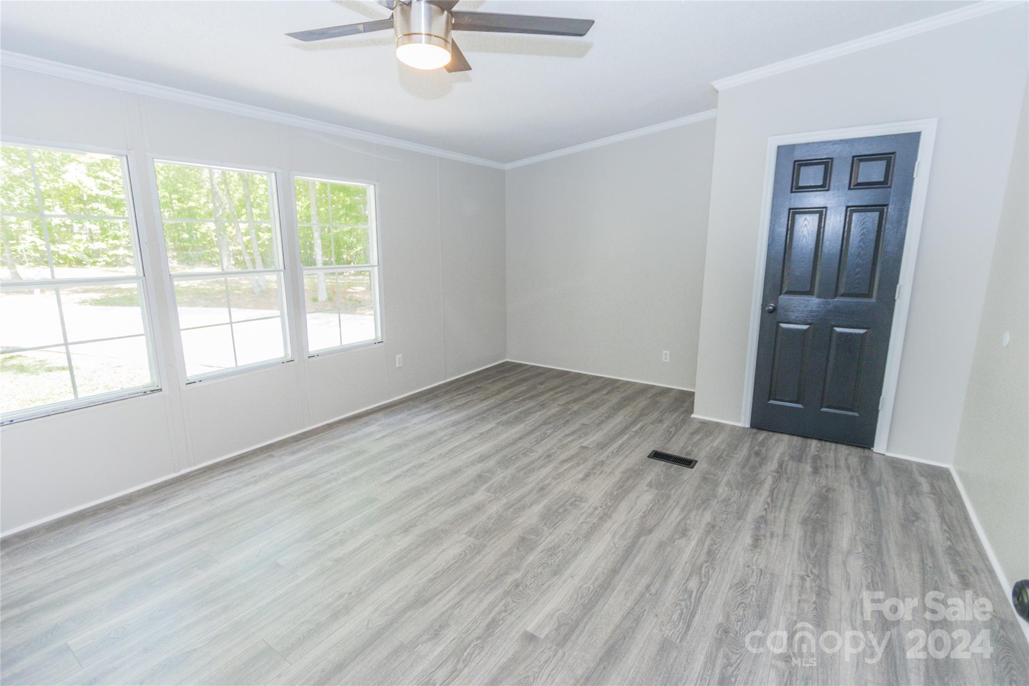 1994 Zion Road Lancaster, SC 29720 - Photo 14 of 45 wooden floor in an empty room with a window