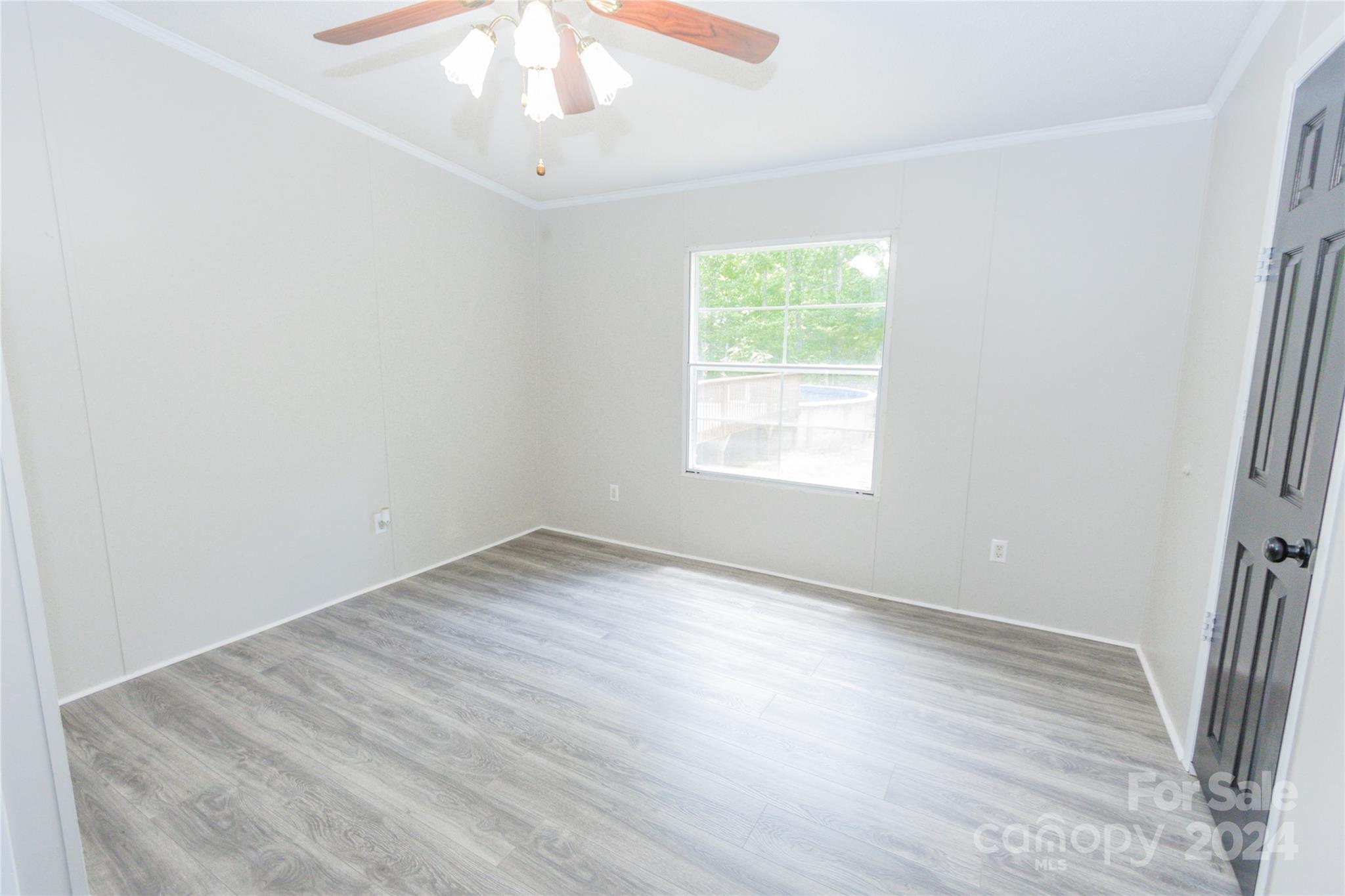 1994 Zion Road Lancaster, SC 29720 - Photo 33 of 45 an empty room with wooden floor and windows