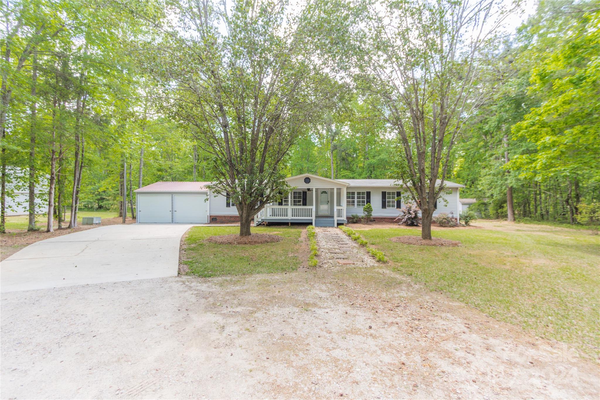 1994 Zion Road Lancaster, SC 29720 - Photo 5 of 45 a house with trees in the background