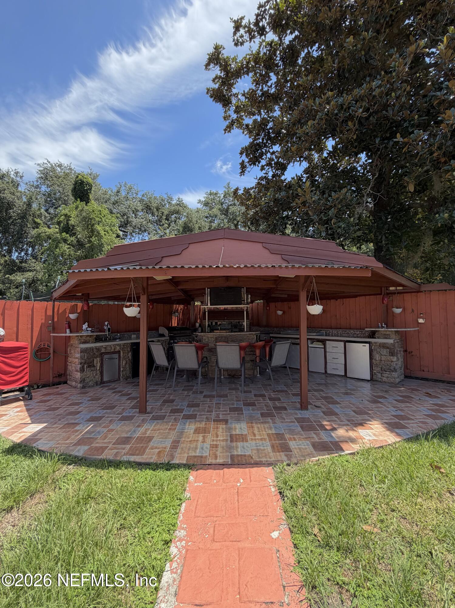 4127 Springwood Road Jacksonville, FL 32207 - Photo 41 of 63 a view of house with backyard and seating space