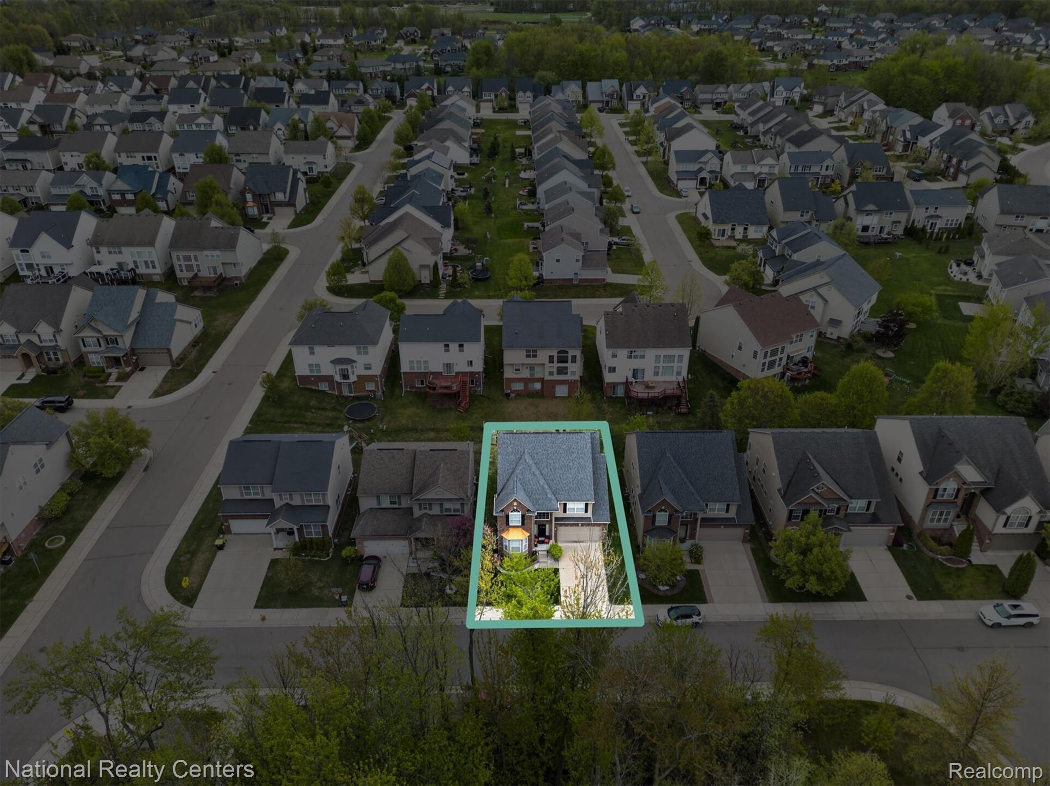 27412 Victoria Road Novi, MI 48374 - Photo 46 of 61 Aerial perspective highlighting a residential property with a light gray shingle roof and brick facade