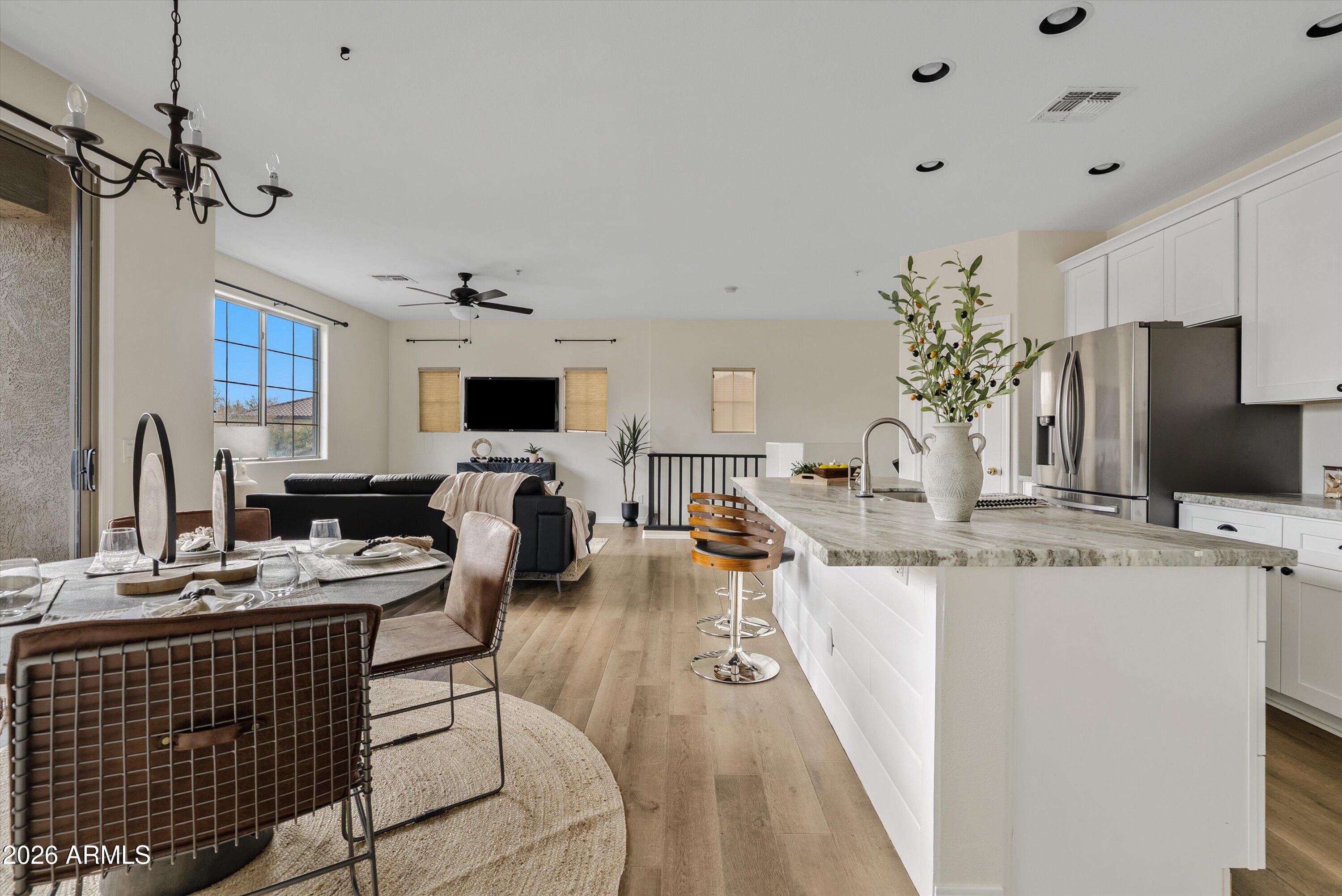 1265 South Aaron, Unit 245 Mesa, AZ 85209 - Photo 10 of 30 a very nice looking dining room with a large window and a chandelier