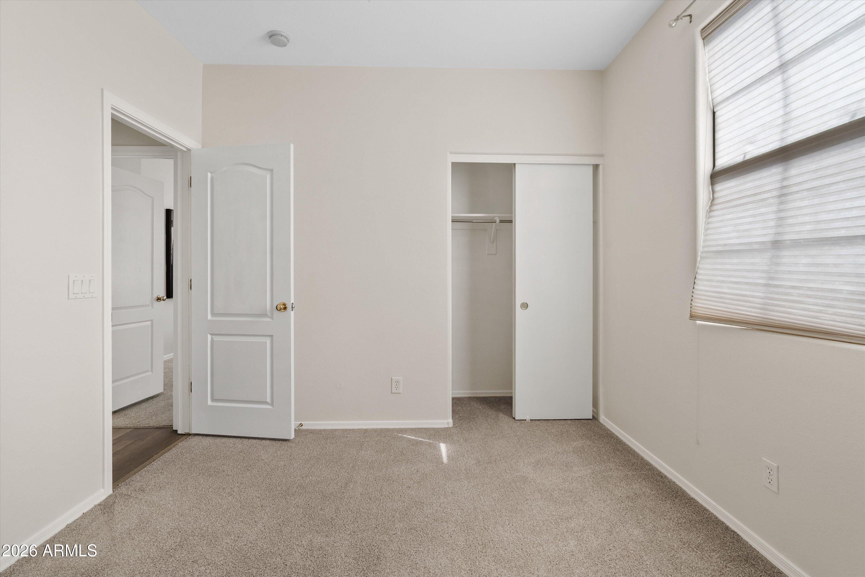 1265 South Aaron, Unit 245 Mesa, AZ 85209 - Photo 13 of 30 a view of an empty room with a window