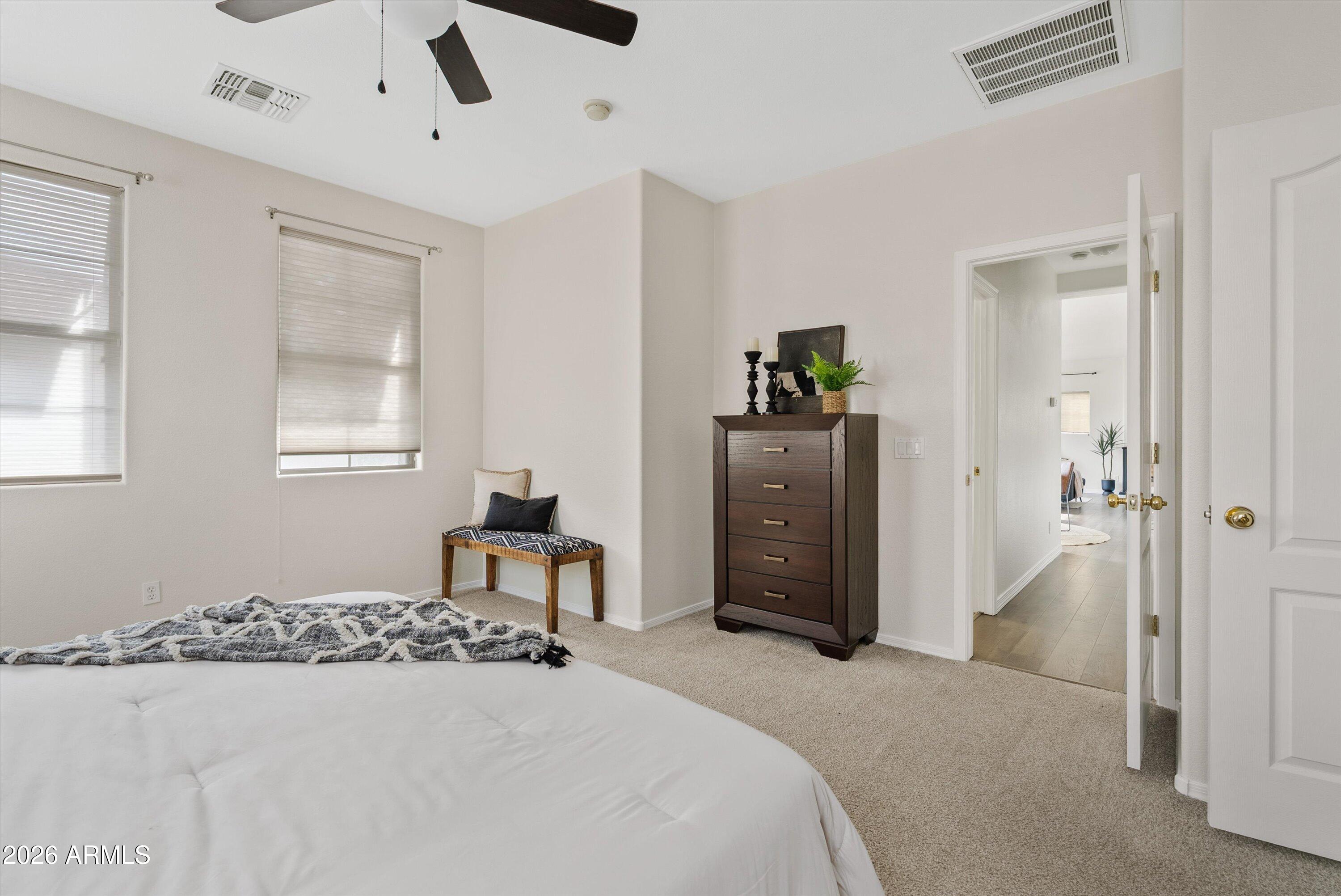 1265 South Aaron, Unit 245 Mesa, AZ 85209 - Photo 18 of 30 a bedroom with a bed and a chandelier