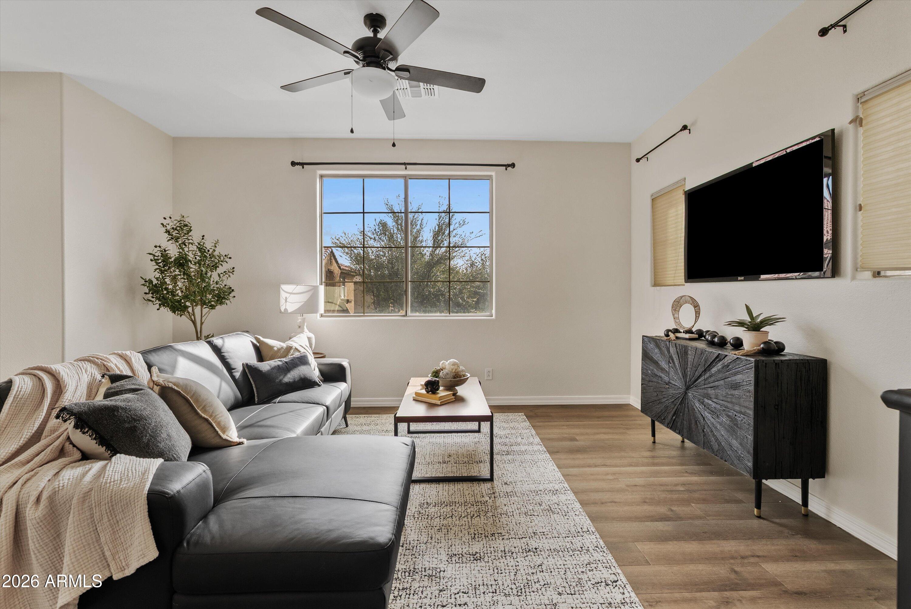 1265 South Aaron, Unit 245 Mesa, AZ 85209 - Photo 2 of 30 a living room with furniture and a flat screen tv