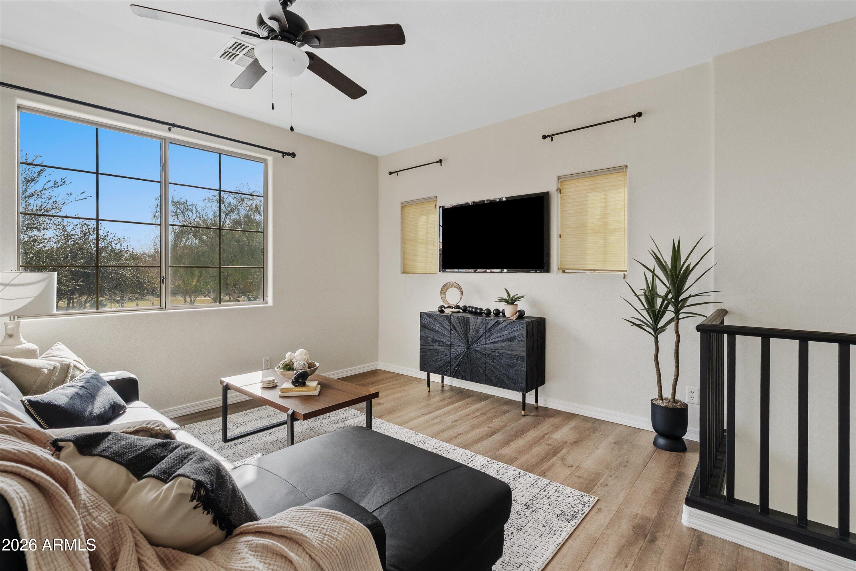 1265 South Aaron, Unit 245 Mesa, AZ 85209 - Photo 3 of 30 a living room with furniture and a flat screen tv
