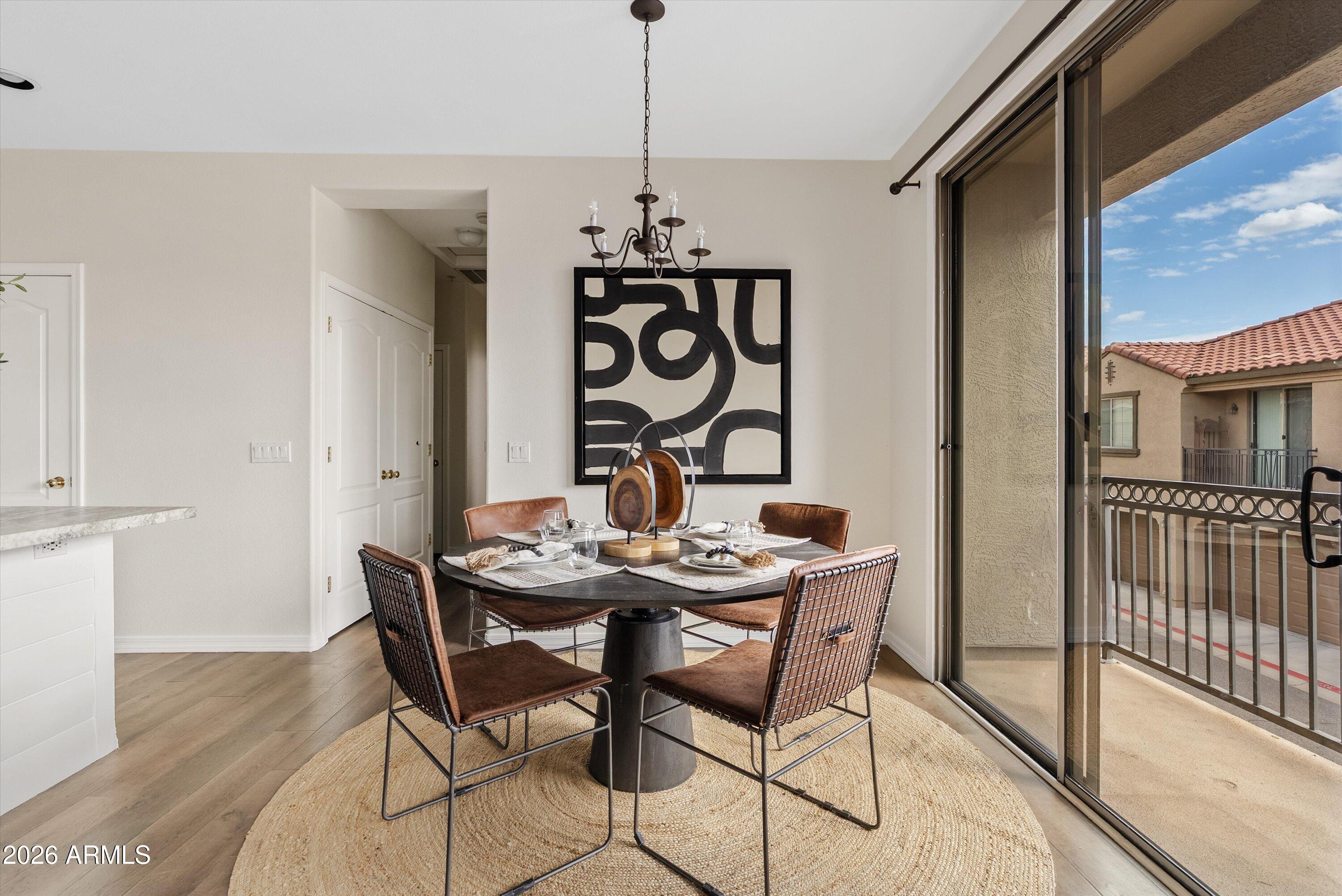 1265 South Aaron, Unit 245 Mesa, AZ 85209 - Photo 6 of 30 a view of a dining room with furniture window and wooden floor