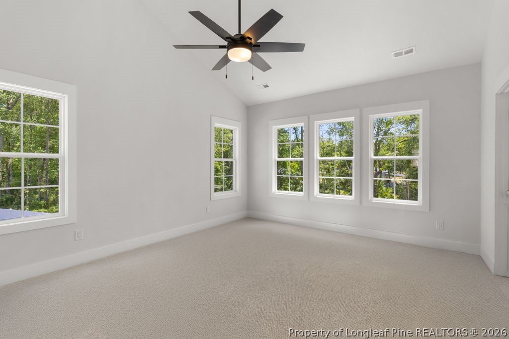 408 Stable Court Linden, NC 28356 - Photo 12 of 29 an empty room with a window and a fan