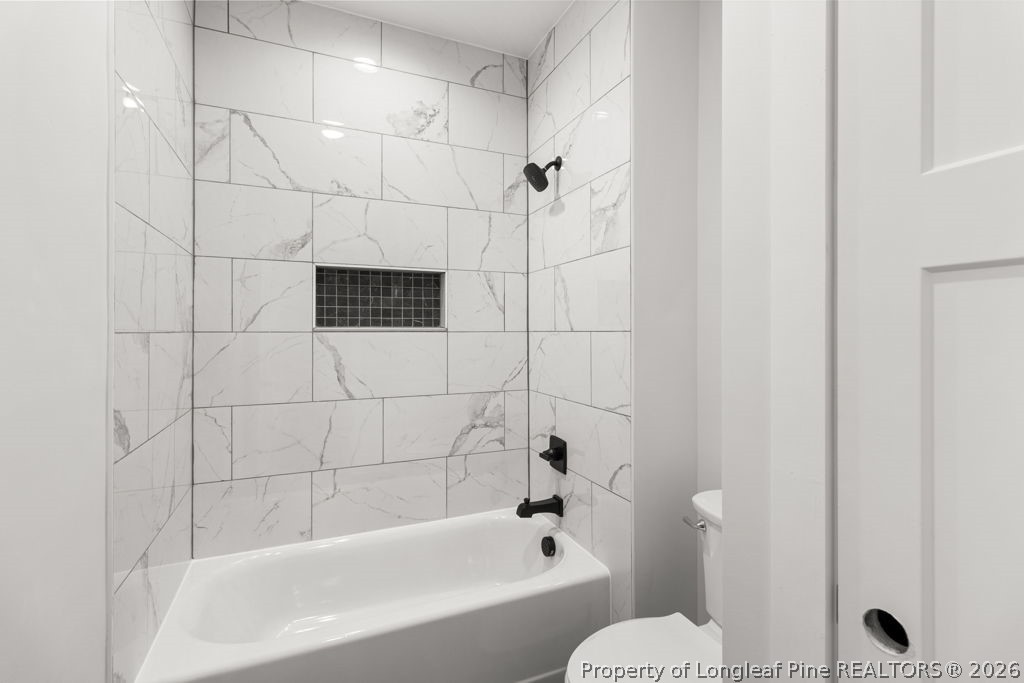 408 Stable Court Linden, NC 28356 - Photo 15 of 29 a bathroom with a bathtub and shower