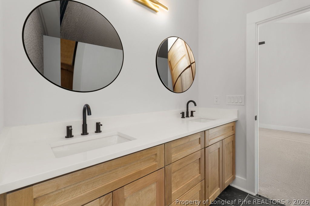 408 Stable Court Linden, NC 28356 - Photo 18 of 29 a bathroom with a sink and a mirror