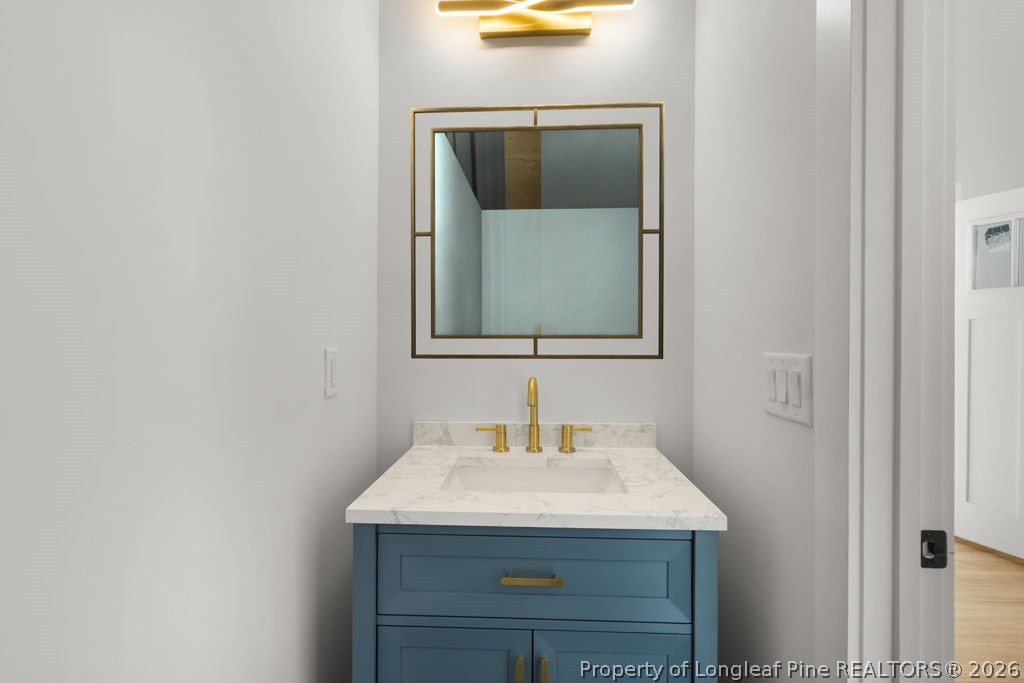 408 Stable Court Linden, NC 28356 - Photo 20 of 29 a bathroom with a sink and a mirror