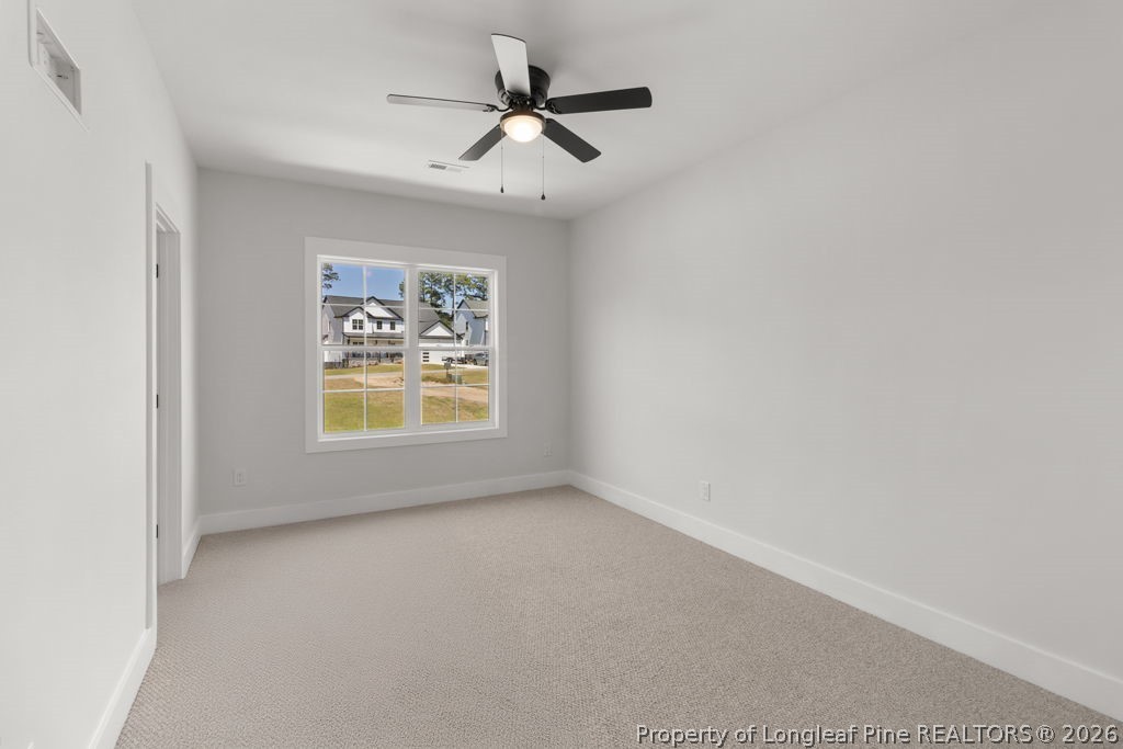 408 Stable Court Linden, NC 28356 - Photo 23 of 29 an empty room with window and ceiling fan