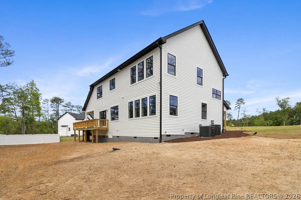 408 Stable Court Linden, NC 28356 - Photo 27 of 29 a view of a white house with a yard