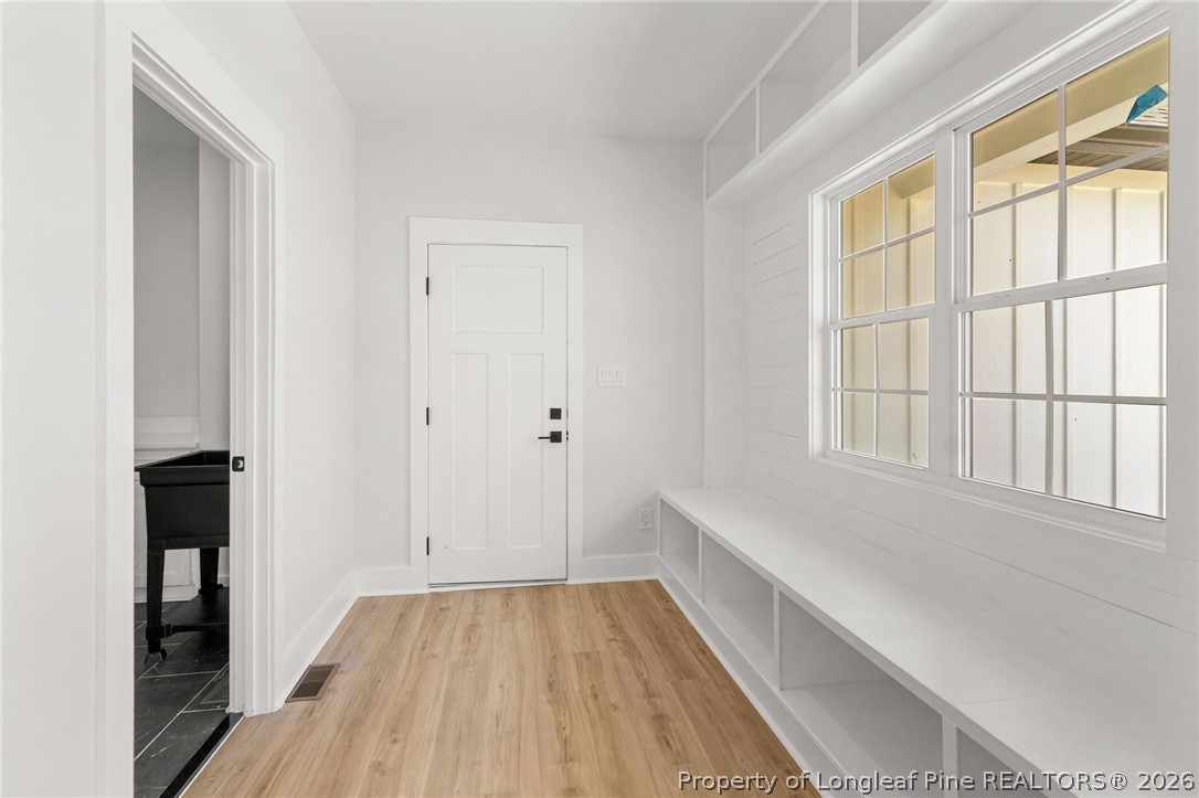 408 Stable Court Linden, NC 28356 - Photo 10 of 29 a view of room with window and wooden floor