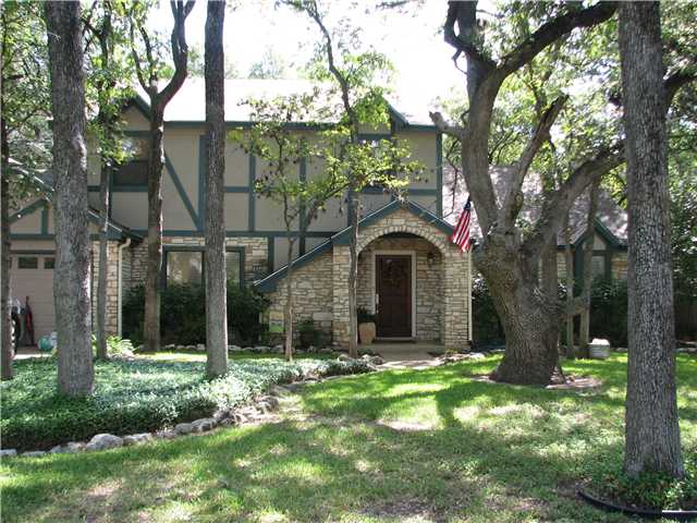 11738 D-K Ranch Road Austin, TX 78759 - Photo 1 of 1 a front view of a house with garden