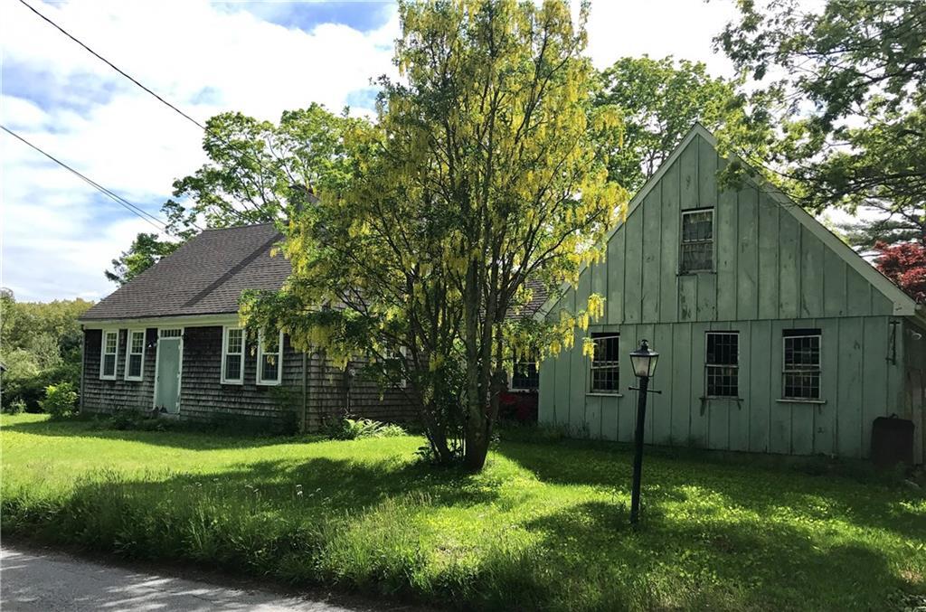 505 Porter Pond Road Sterling, CT 06354 - Photo 1 of 1 a front view of a house with a garden