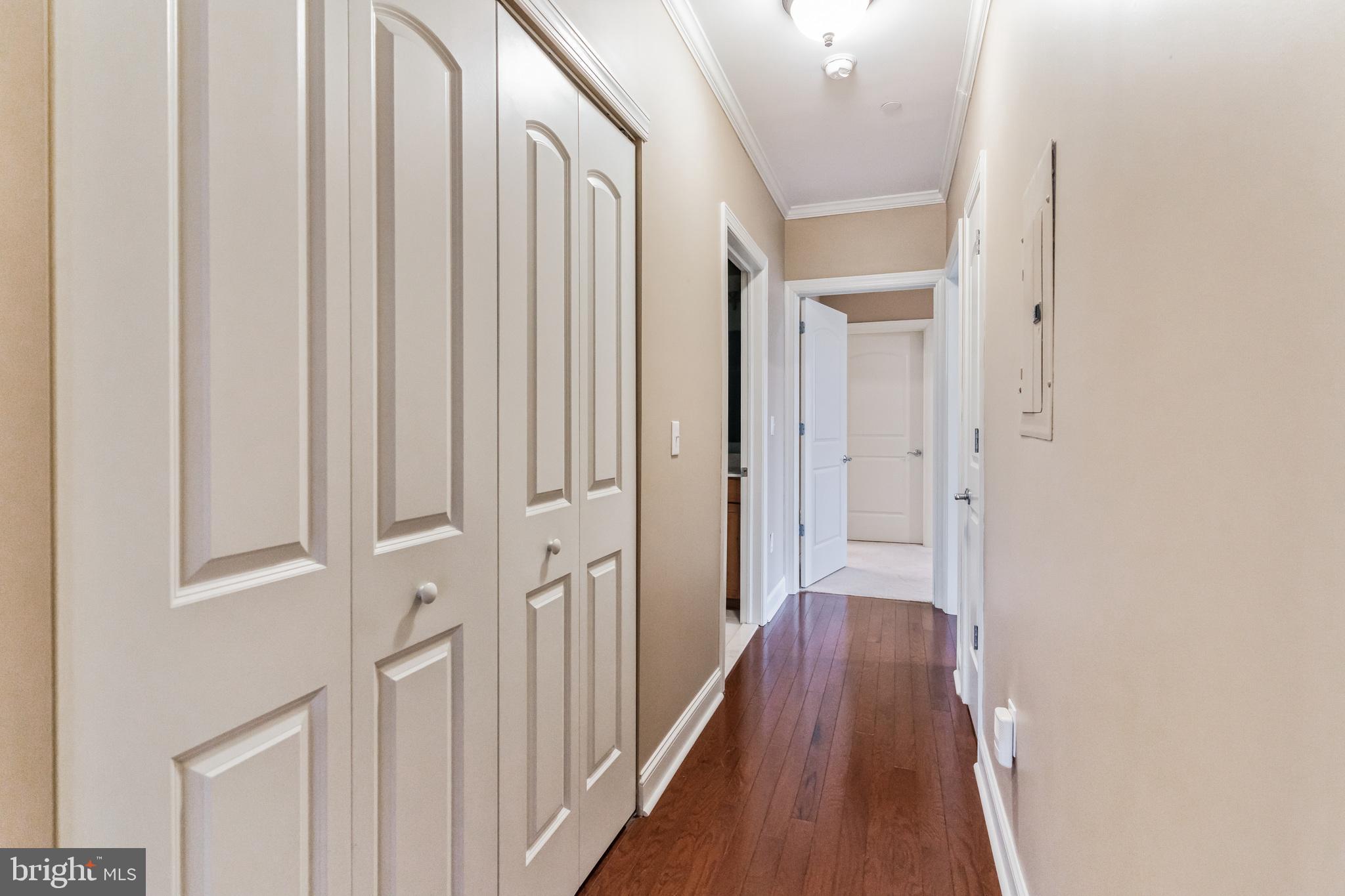 200 Ernest Way, Unit 218 Philadelphia, PA 19111 - Photo 23 of 44 Hallway w/ Washer/Dryer in Closet + a Linen Closet