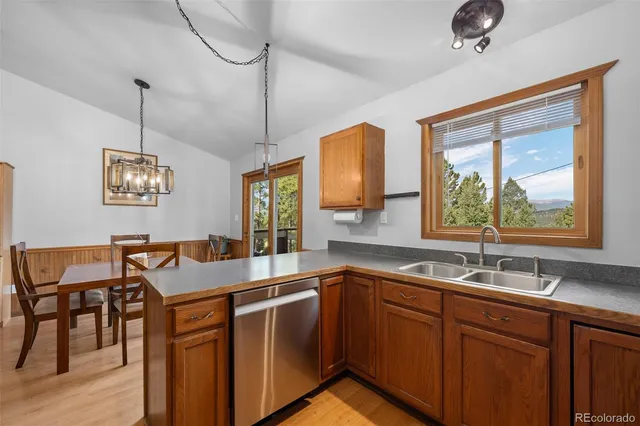 a kitchen with center island and windows