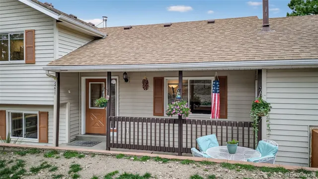 a view of a lush green hillside and a houses