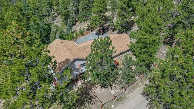 a view of a green field with mountains in the background