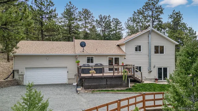 a view of a lush green field with a mountain in the background