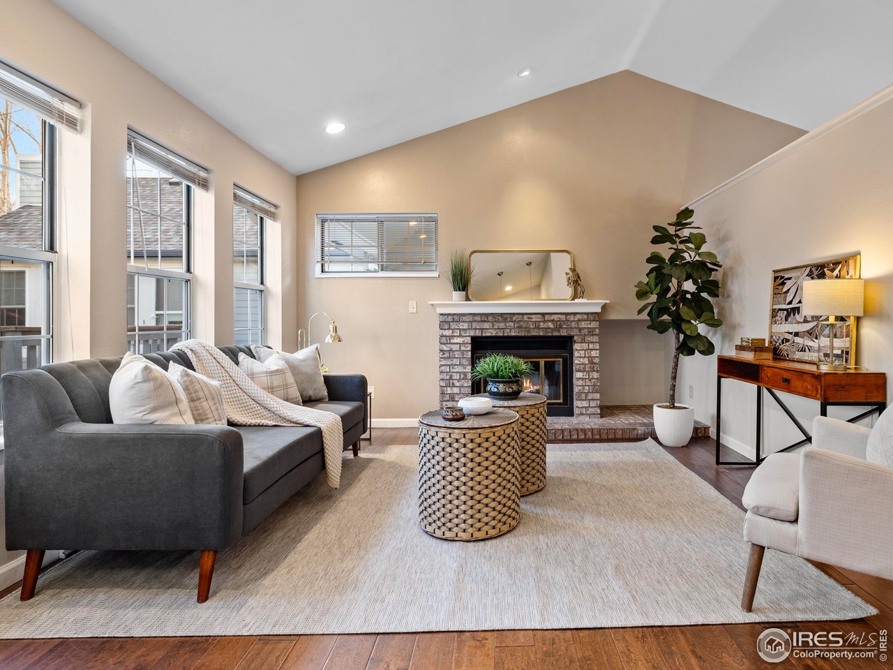 1601 West Swallow Road, Unit 8C Fort Collins, CO 80526 - Photo 1 of 36 a living room with furniture and a fireplace