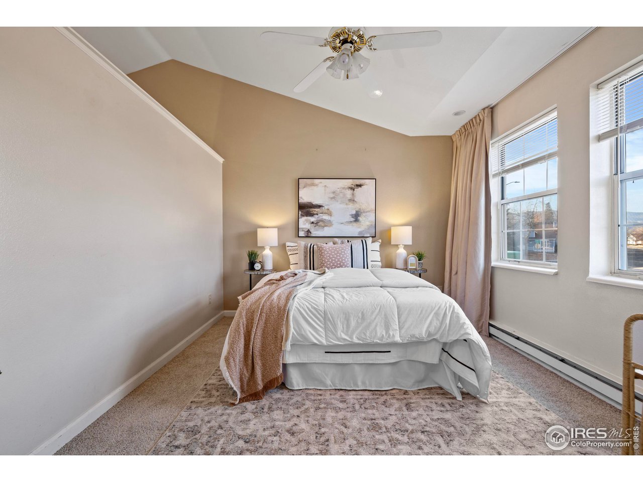 1601 West Swallow Road, Unit 8C Fort Collins, CO 80526 - Photo 14 of 36 a spacious bedroom with a bed and wooden floor