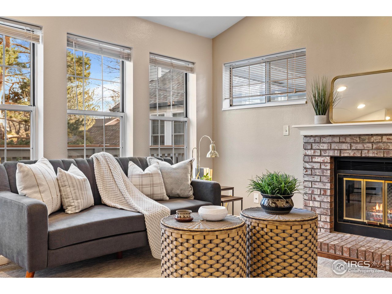 1601 West Swallow Road, Unit 8C Fort Collins, CO 80526 - Photo 4 of 36 a living room with furniture and a fireplace