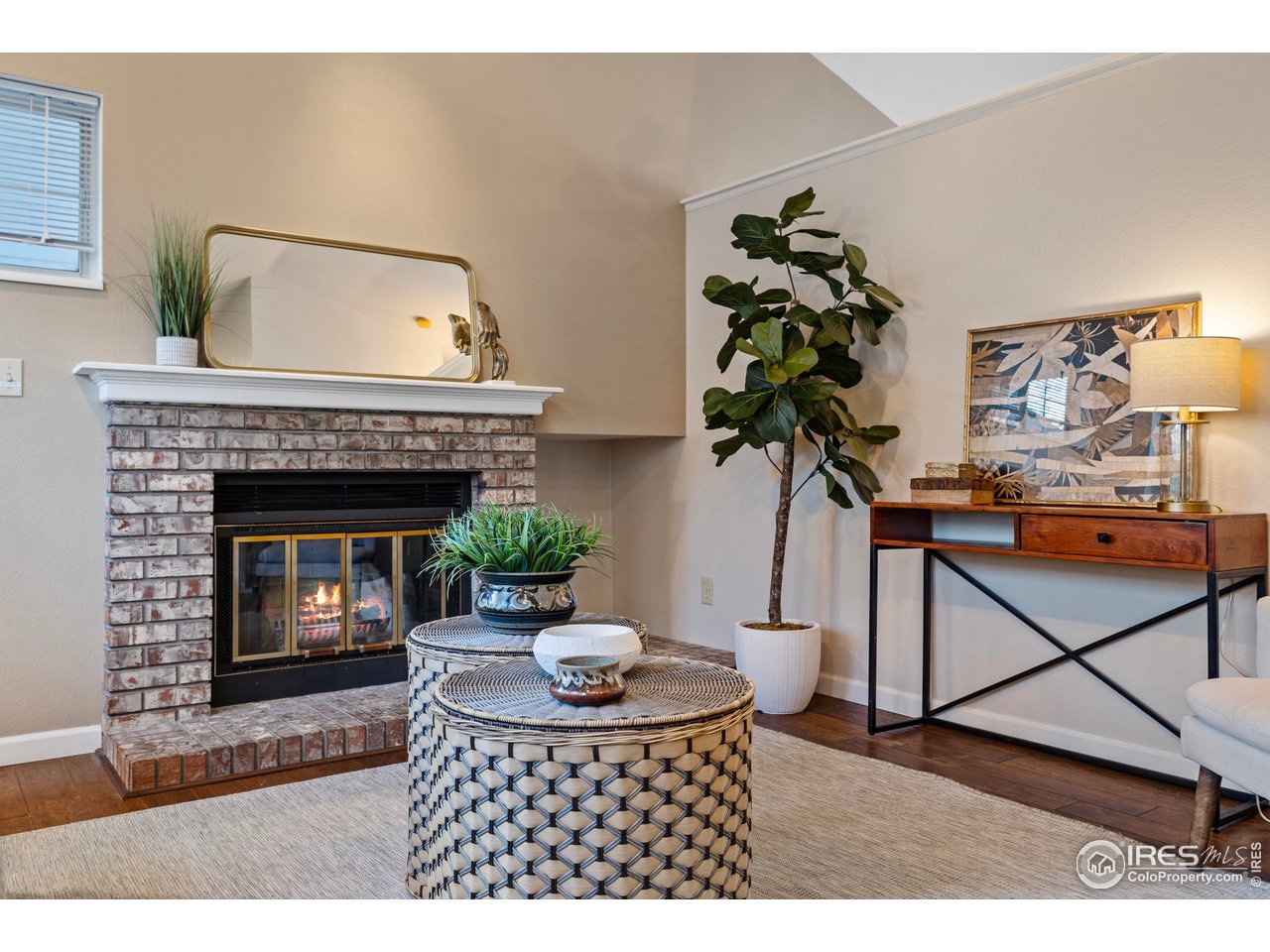 1601 West Swallow Road, Unit 8C Fort Collins, CO 80526 - Photo 5 of 36 a living room with furniture and a fireplace