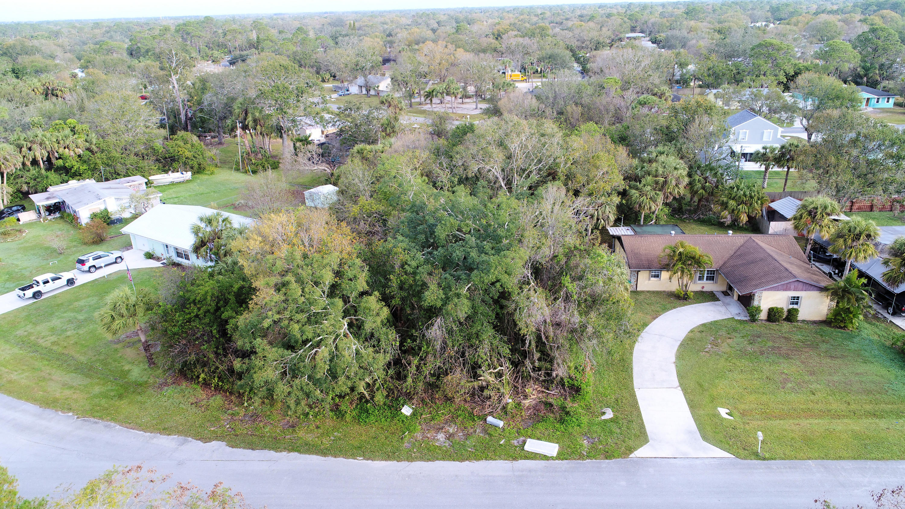 Tbd Hibiscus Road Fort Pierce, FL 34951 - Photo 1 of 7 an aerial view of a house with a yard and lake view