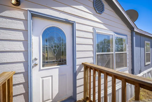 a view of a door and a window