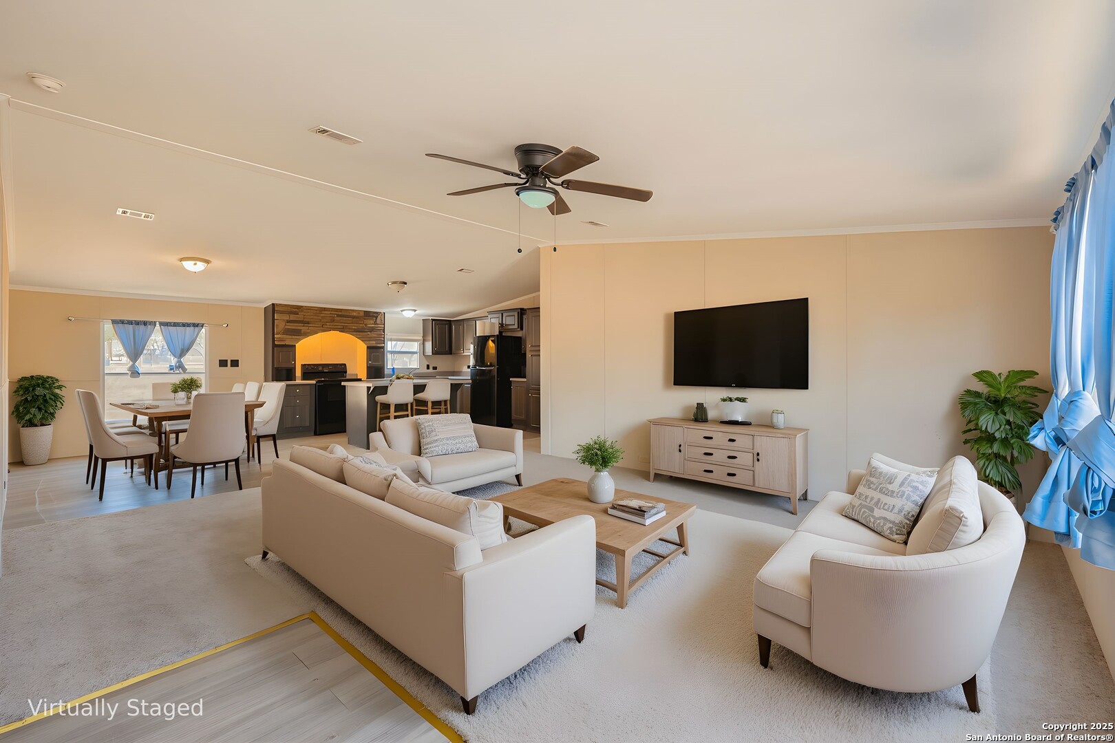 1007 County Road 773 Devine, TX 78016 - Photo 4 of 31 a living room with furniture and a flat screen tv
