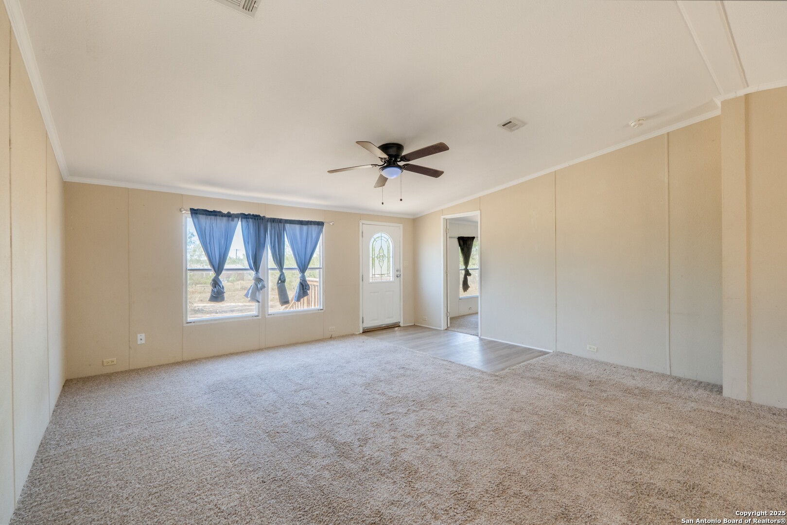 1007 County Road 773 Devine, TX 78016 - Photo 5 of 31 a view of an empty room with a window
