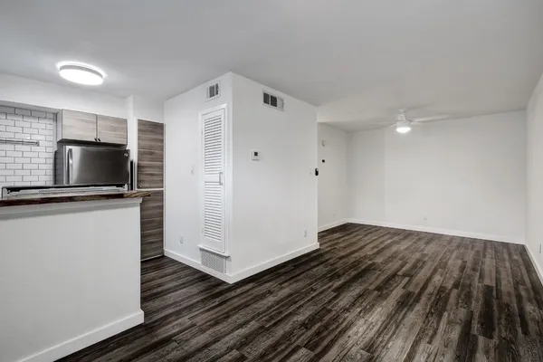 a view of a livingroom with wooden floor