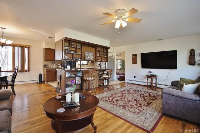 a living room with fireplace furniture and a flat screen tv